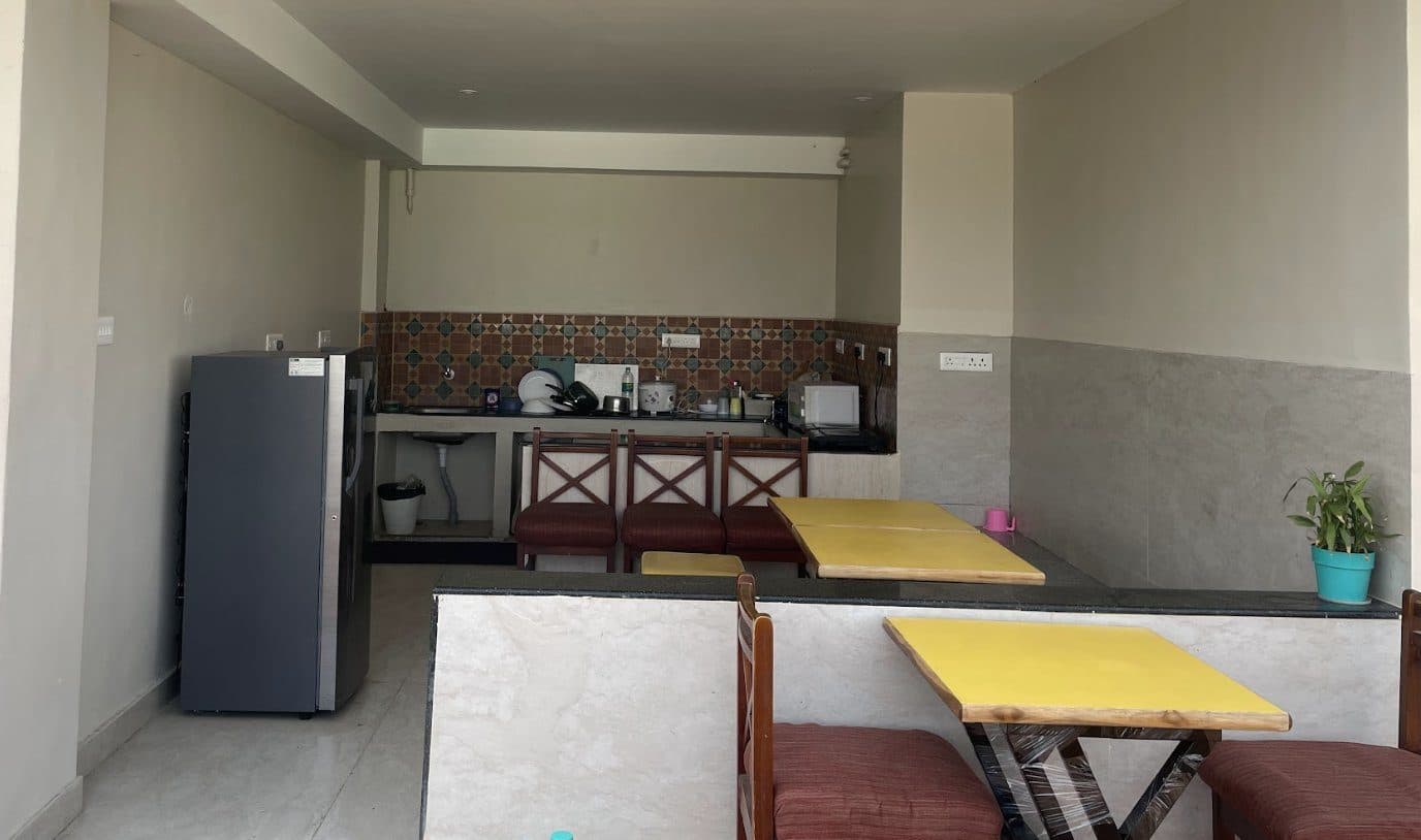 Shared kitchen and dining facilities for long stays at Raghav Residency